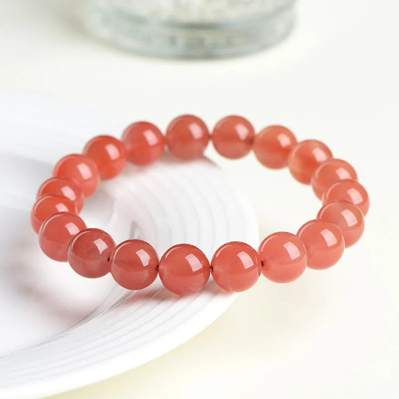 Natural South Red Cherry Agate scattered bead bracelet showing cherry red colour and polished surface