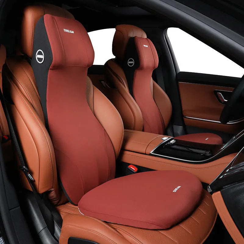 Black automotive memory foam seat cushion with integrated lumbar support headrest pillow.