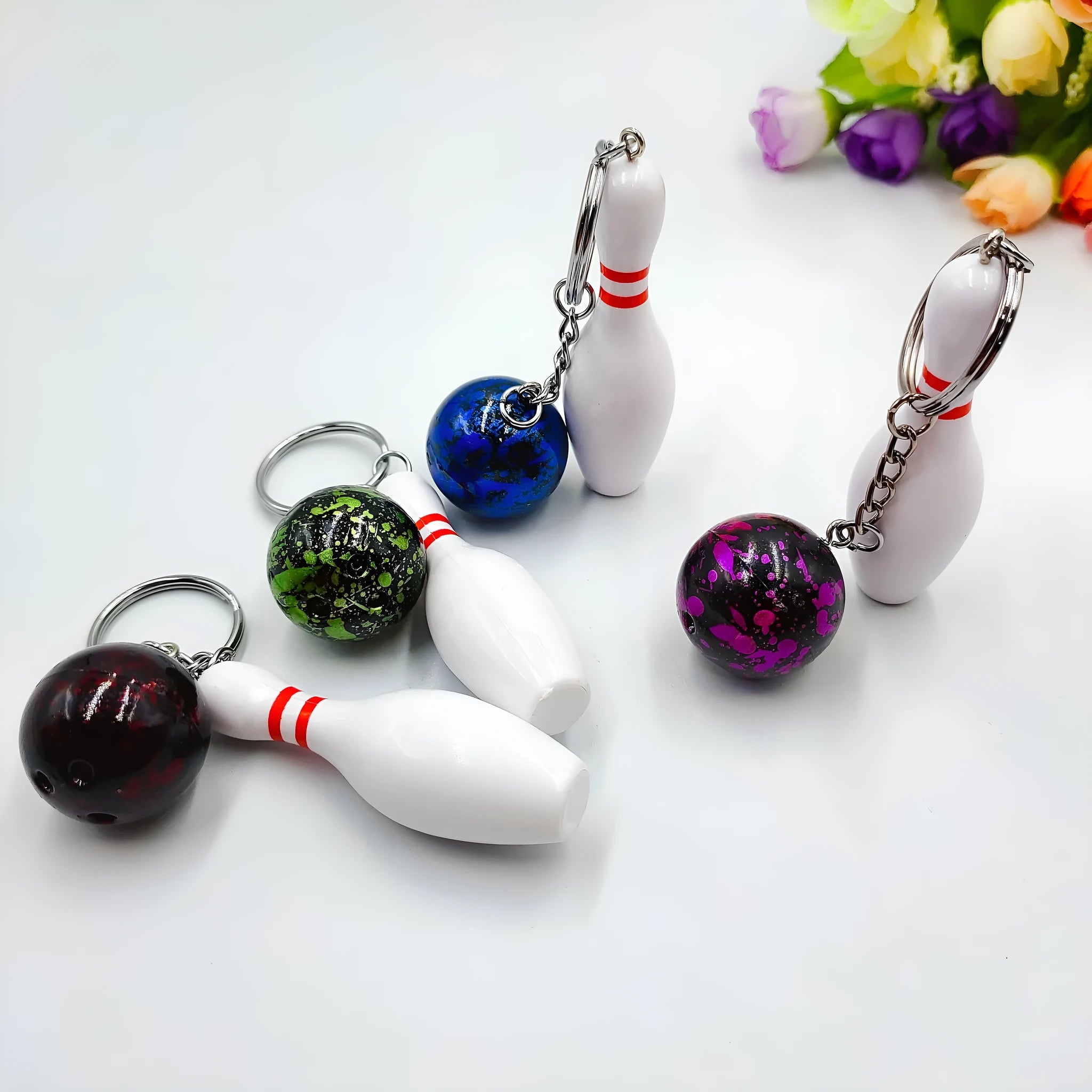 Mini bowling keychain pendant in four colour options on keyring