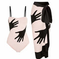 Women's patterned polyester bikini swimsuit with a long attached tulle skirt overlay.