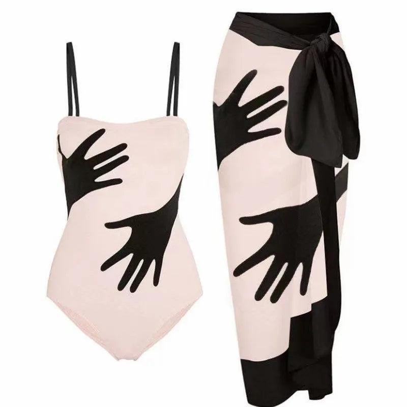 Women's patterned polyester bikini swimsuit with a long attached tulle skirt overlay.