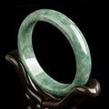 Natural dark pea green jade beaded bracelet for women, shown with gift box.