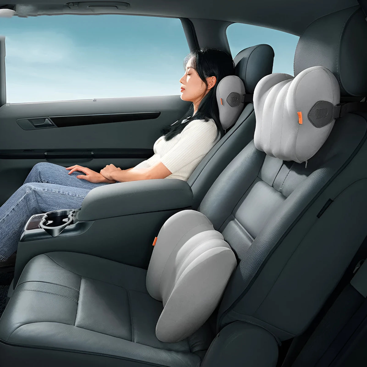 Grey and orange dual car pillow for head and lumbar support with memory cotton filling.