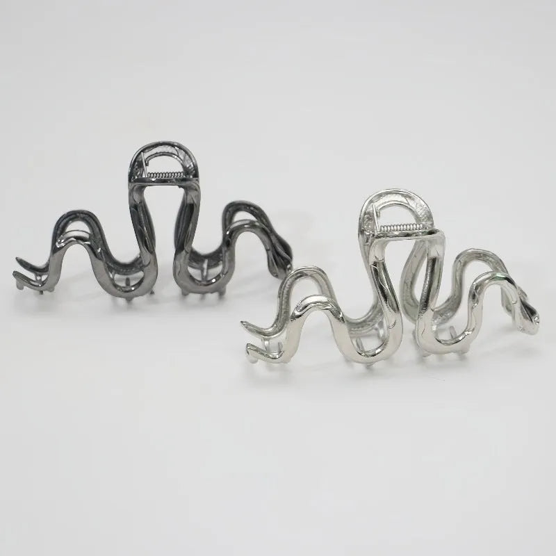 Slytherin serpentine snake design metal hair clip barrette in silver and gun black, 10.5cm long.