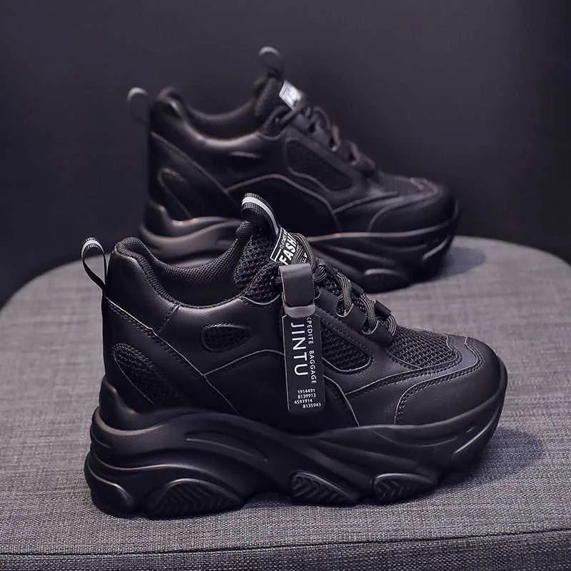 Women's black mesh platform casual shoes with hollow-out design and a toe holder on a white background.