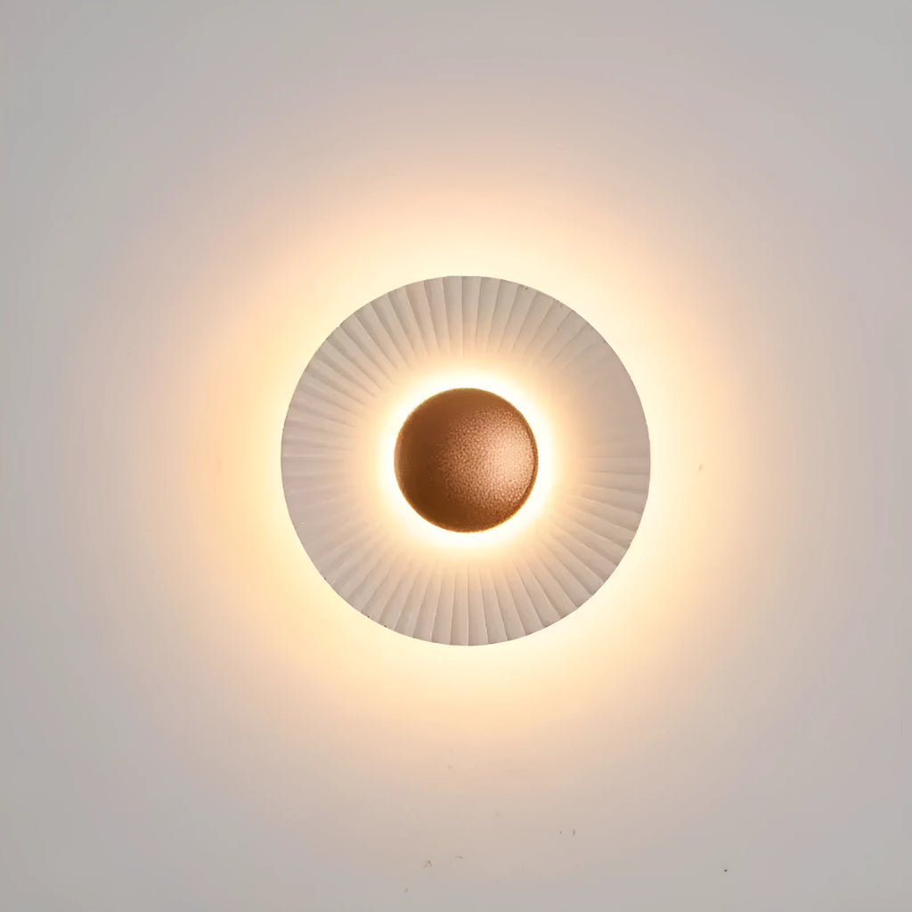 Round aluminium wall lamp with white and gold colour options mounted on wall
