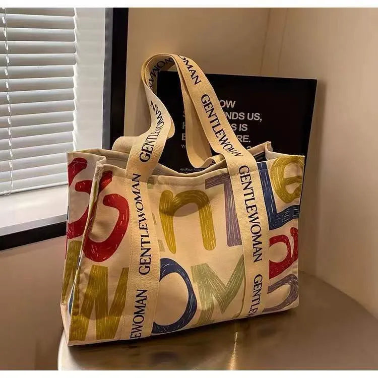 Canvas women's travel tote shoulder bag with printed design in large capacity format