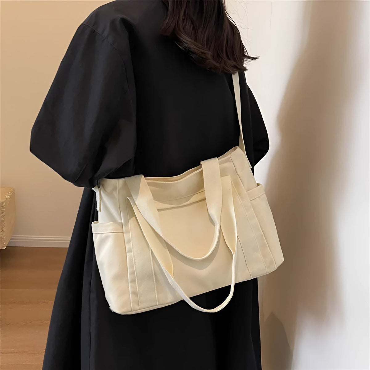 Large canvas shoulder bag for women in solid colour with external pocket and internal phone compartment
