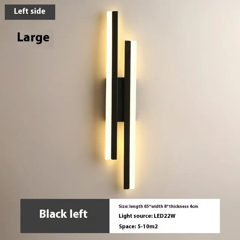 Scandinavian minimalist LED wall light with an acrylic shade on a black arm, mounted on a light-coloured wall.
