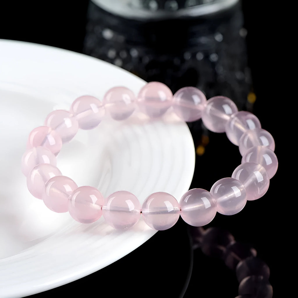 Women's crystal bracelet with polished round beads in pink starlight crystal, available in multiple bead sizes