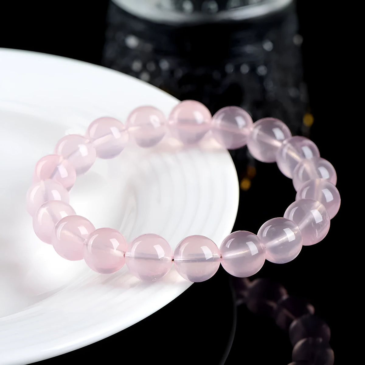 Women's crystal bracelet with polished round beads in pink starlight crystal, available in multiple bead sizes