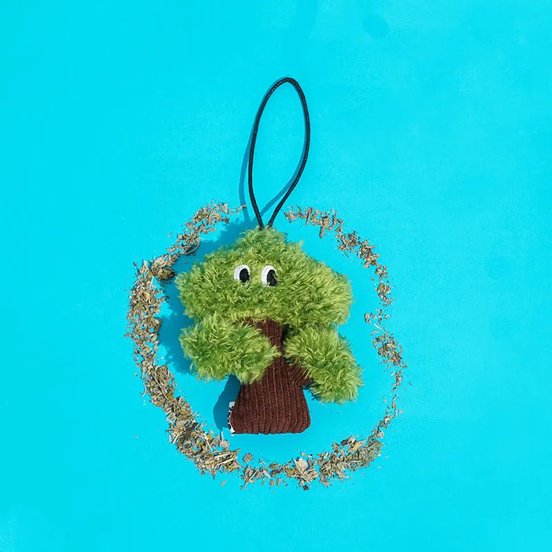 Pine tree-shaped cat chew toy with a dangling pendant, shown in three sizes.