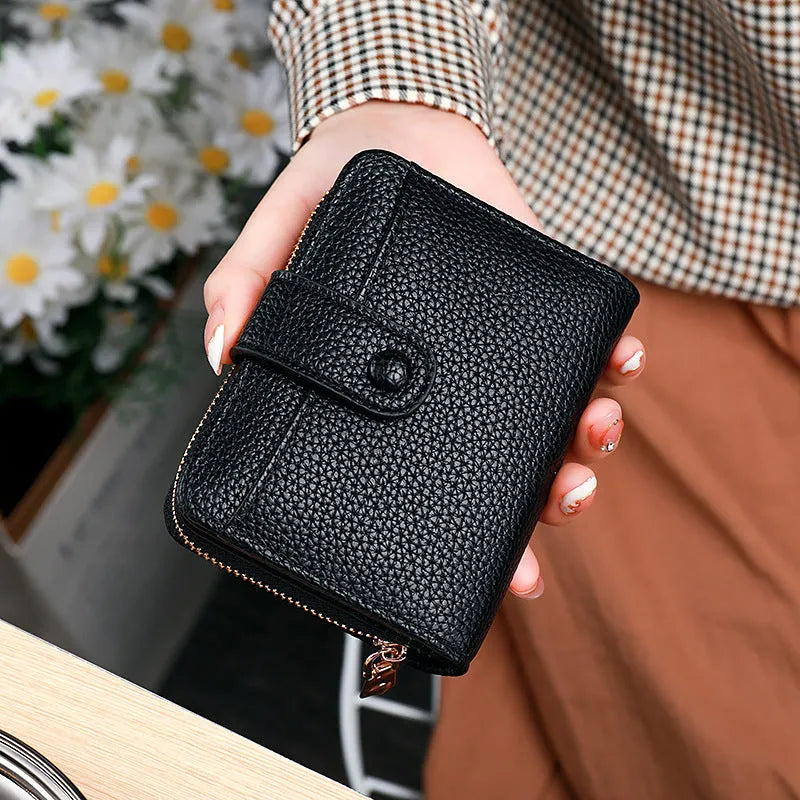 Women's lychee pattern PU leather short wallet showing card slots and cash compartment