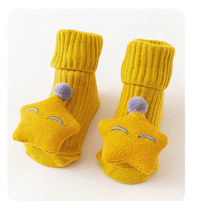 Cotton baby floor socks in a selection of colours and patterns like panda, lion, and bows, shown in sizes for infants.