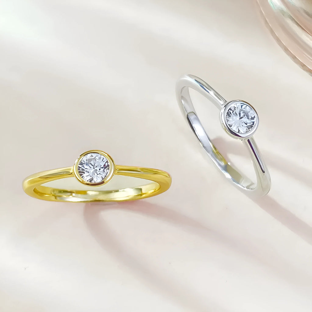 Minimalist sterling silver crown ring with smooth lines in R962 gold or platinum electroplate.
