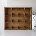 Square solid wood cup storage rack with multiple grids in birch meridian colour.