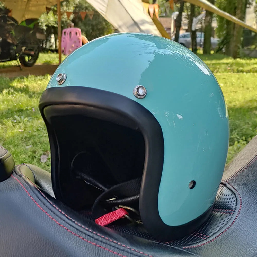 Glass fibre retro motorcycle half helmet shown in cement grey colour on size M