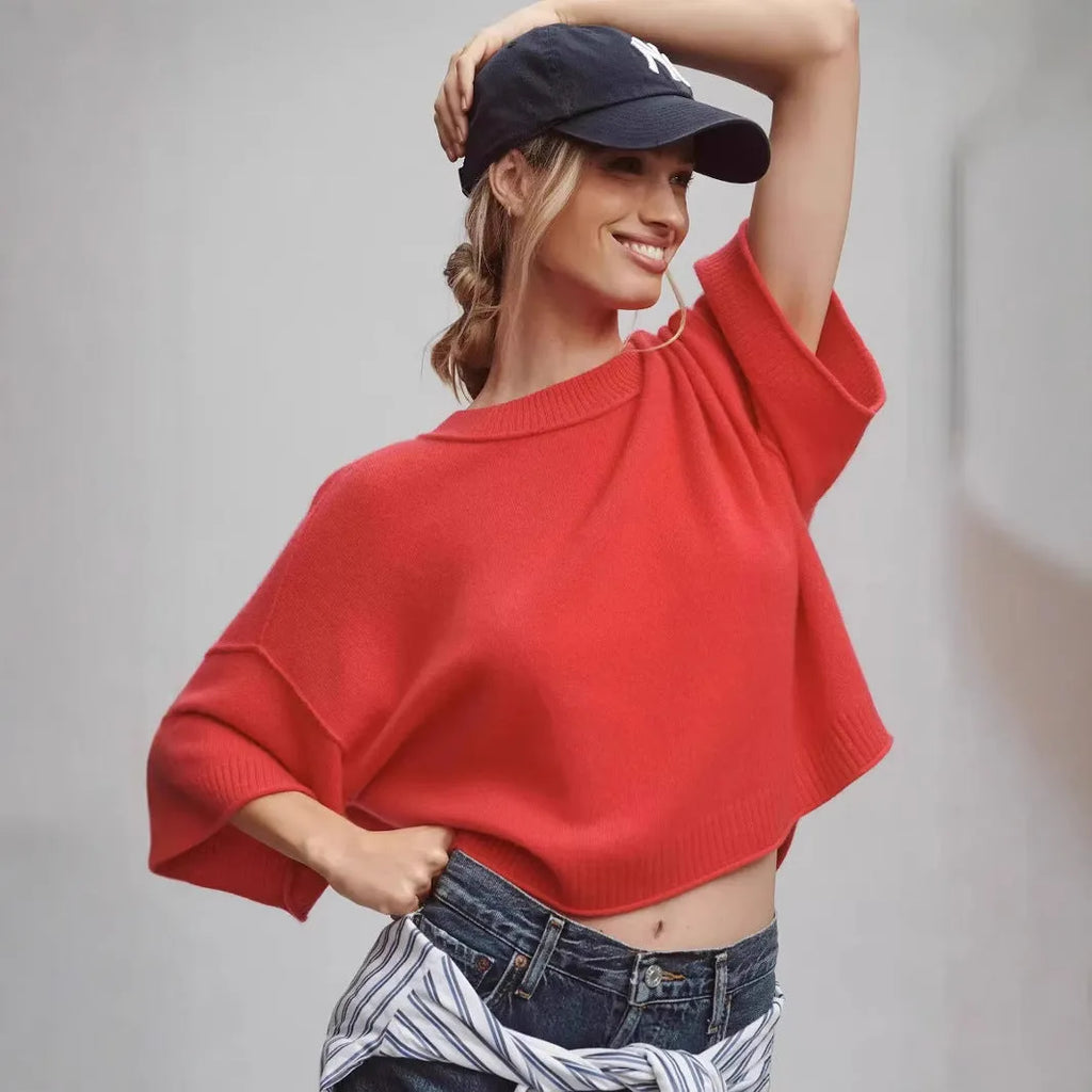 Red cropped T-shirt with exposed navel detail on mannequin
