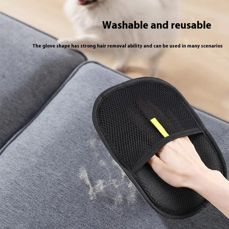 Black pet hair removal glove with silicone bristles on a hand, grooming a dog.