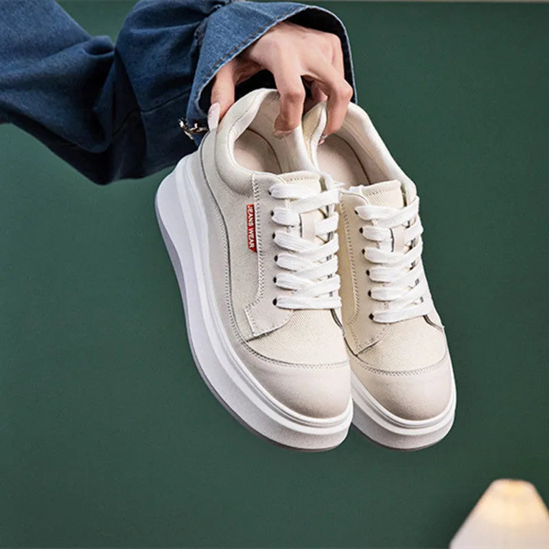 Women's pink leather board shoes with thick white soles on a neutral background