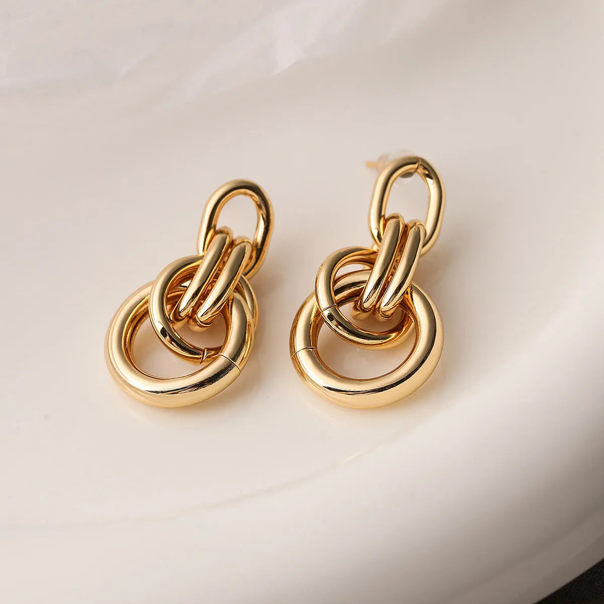Gold-coloured geometric women's earrings with irregular angles, approximately 20-24mm length