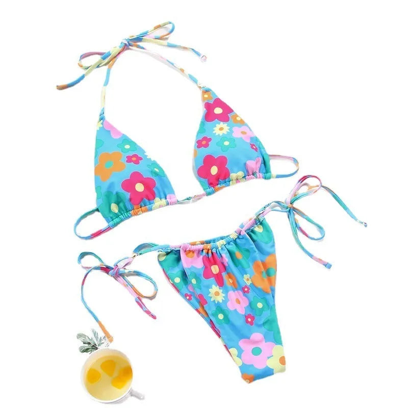 Women's polka dot print split swimsuit bikini set in polyester on a mannequin.