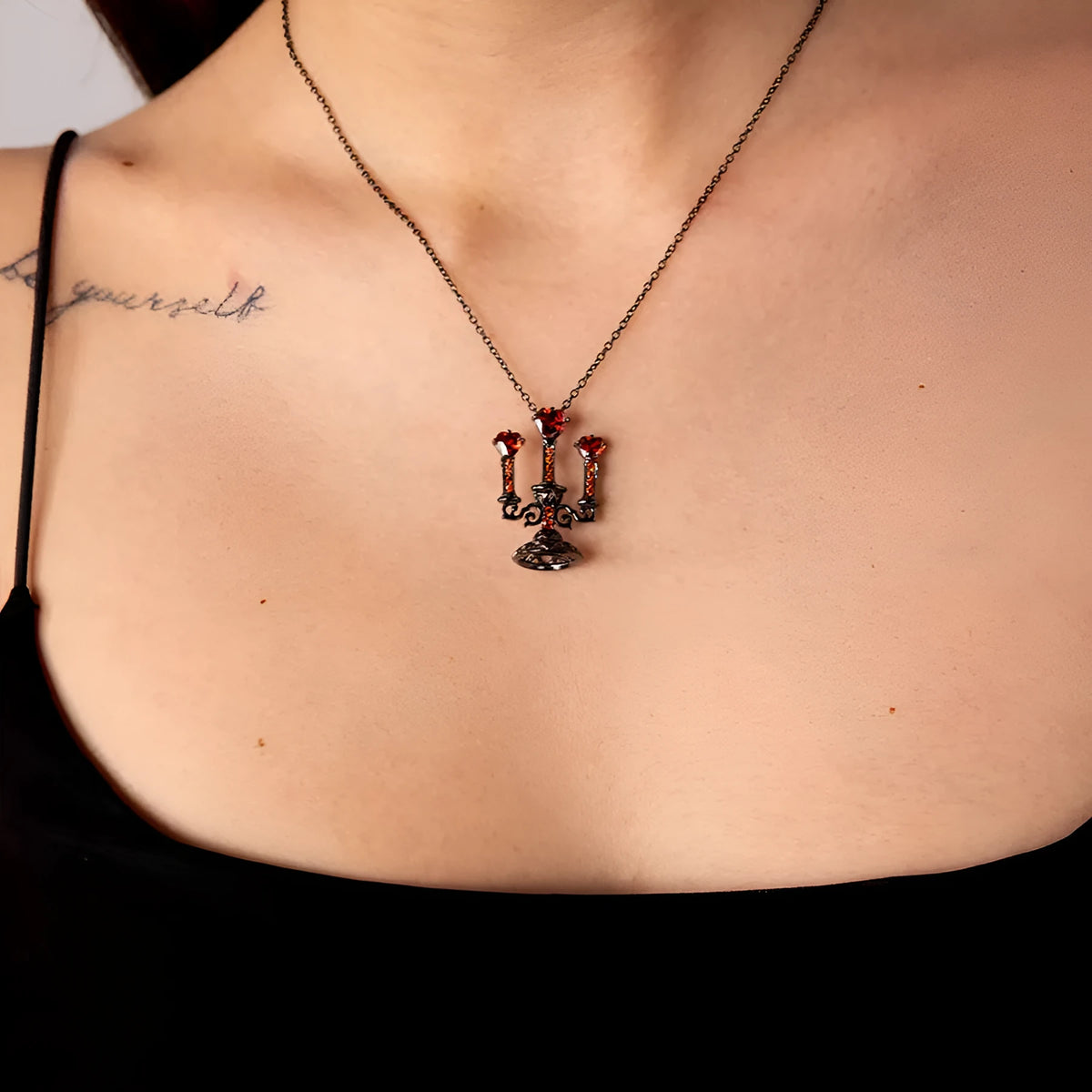 Women's zinc alloy clavicle necklace with a hollow retro candlestick pendant on a cross chain.