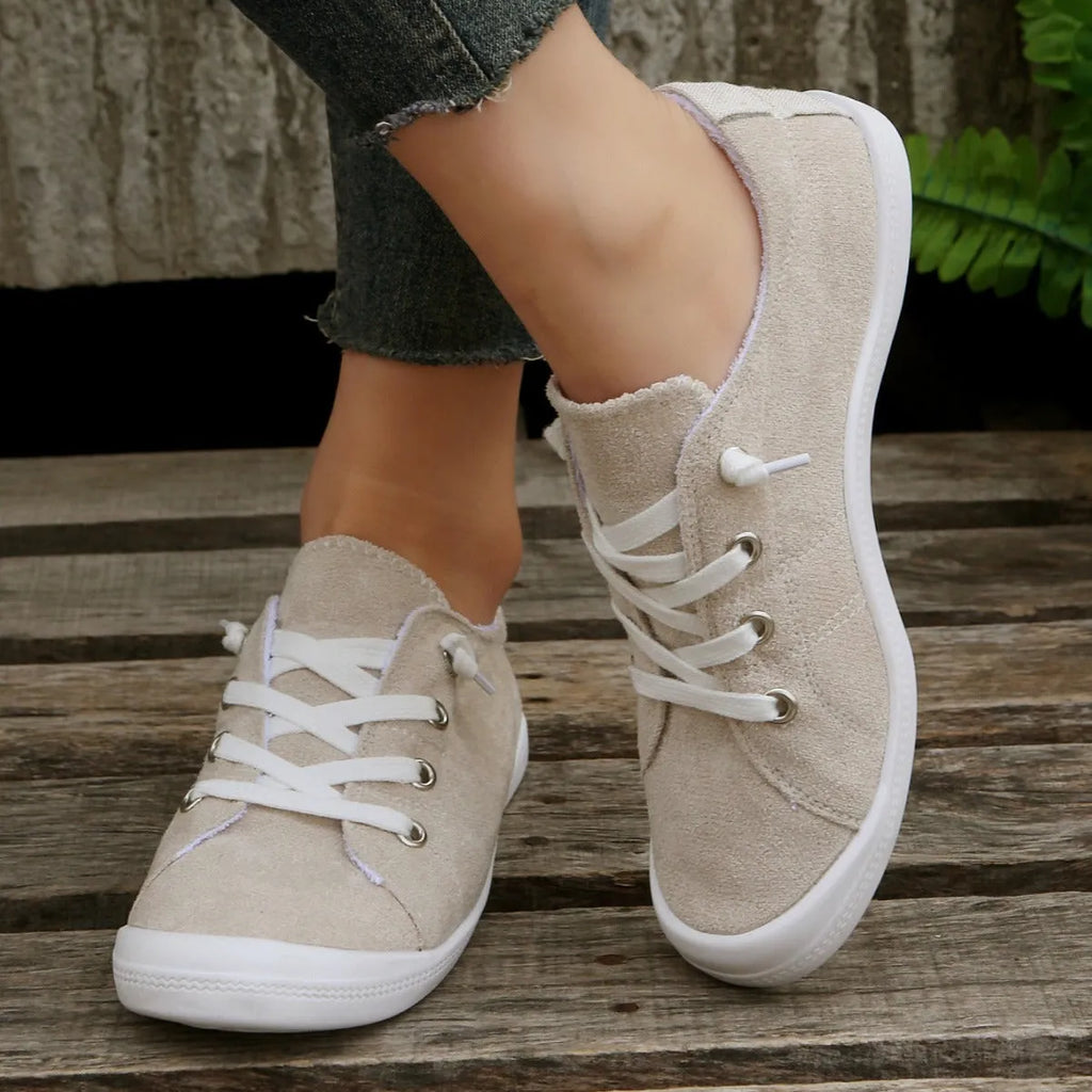 Women's creamy-white casual sneakers with low top fabric upper and rubber sole