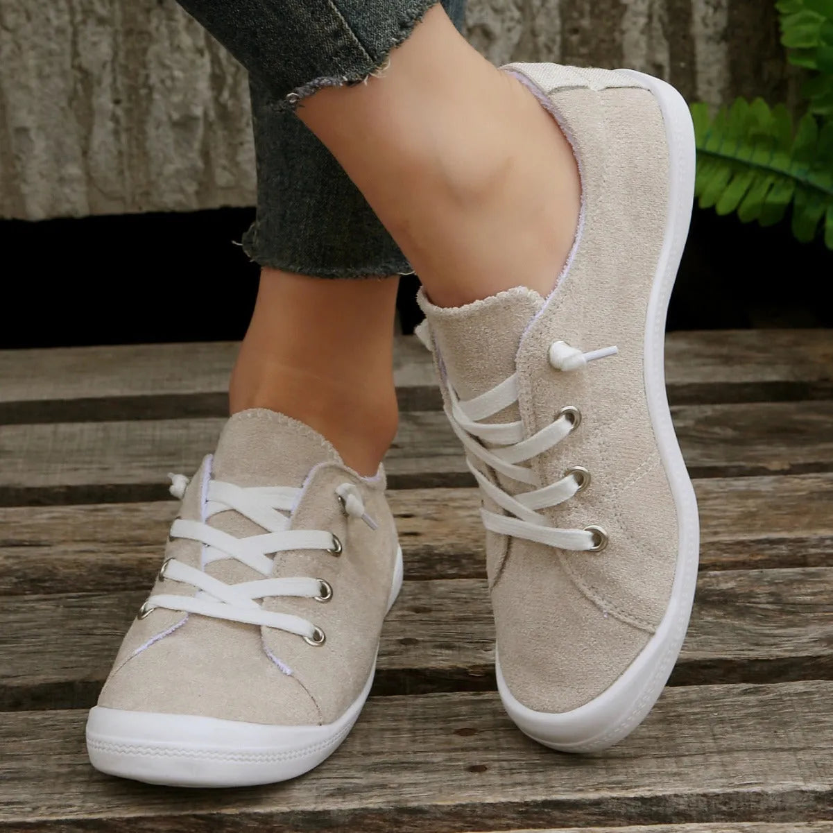 Women's creamy-white casual sneakers with low top fabric upper and rubber sole
