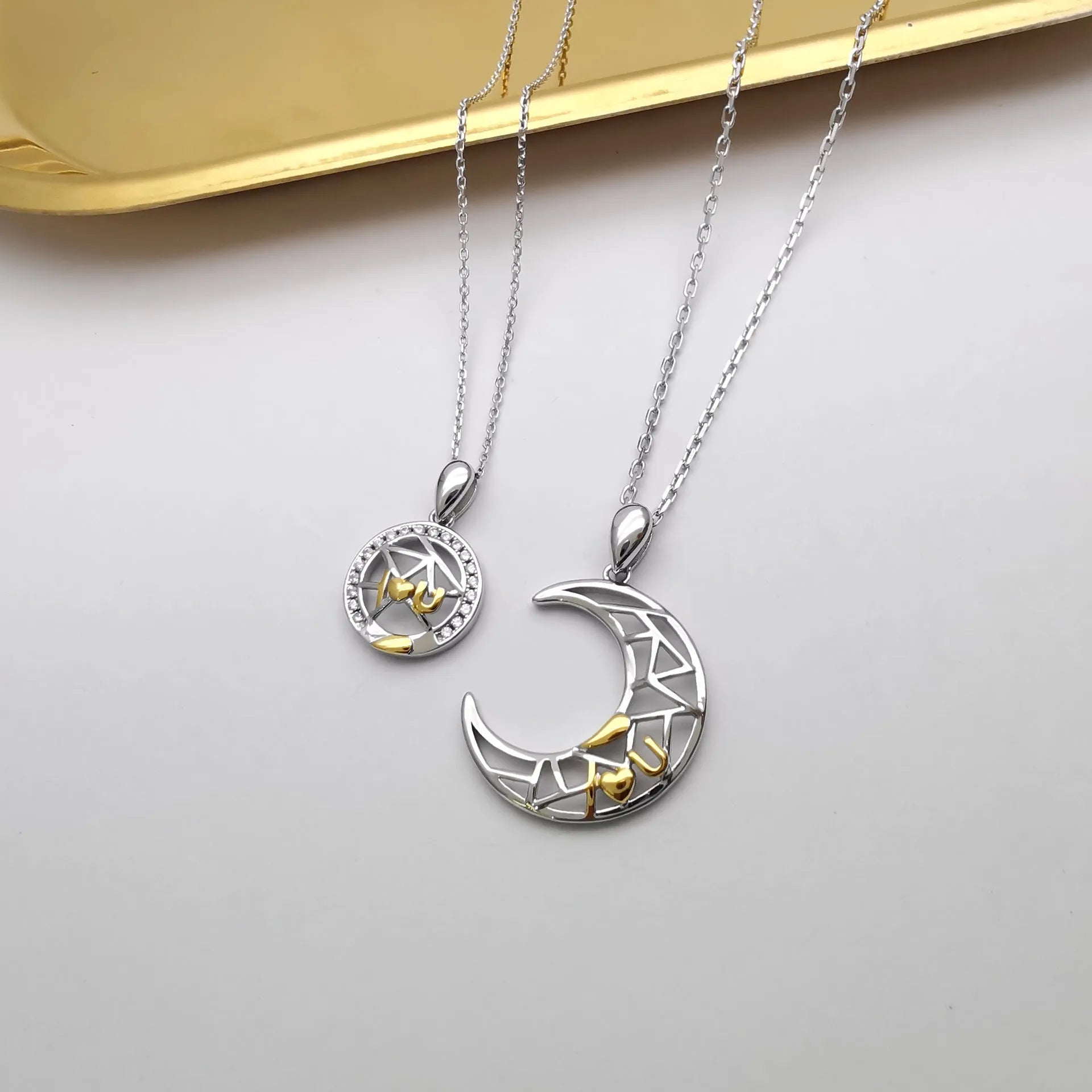 Sun and moon couple necklace set with electroplated copper pendants on cross chain