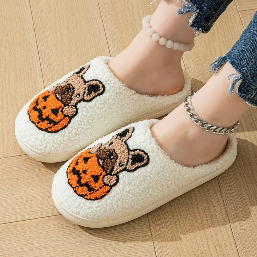 Black and white Halloween pumpkin patterned plush slippers with round toe and TPR rubber soles