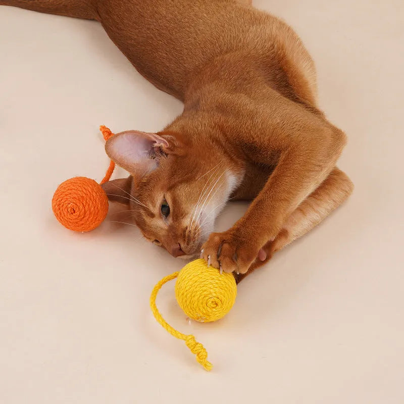 Bite-resistant cat teaser stick with wire core and three attached colourful catnip balls.