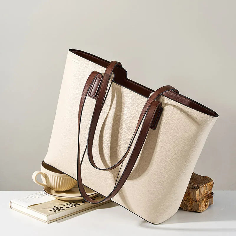 Women's black genuine leather crossbody shoulder bag with multiple internal compartments and a single strap