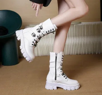 Women's black mid-calf buckle knight boots with side zip on a white background