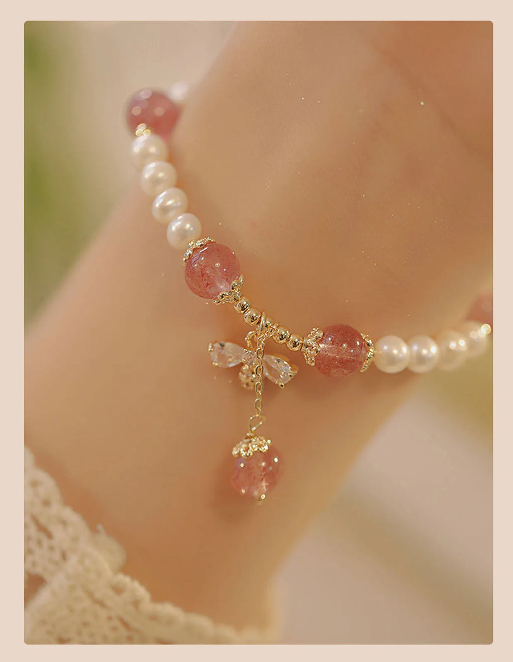 Strawberry quartz crystal bracelet with stringed pearls and bow detail