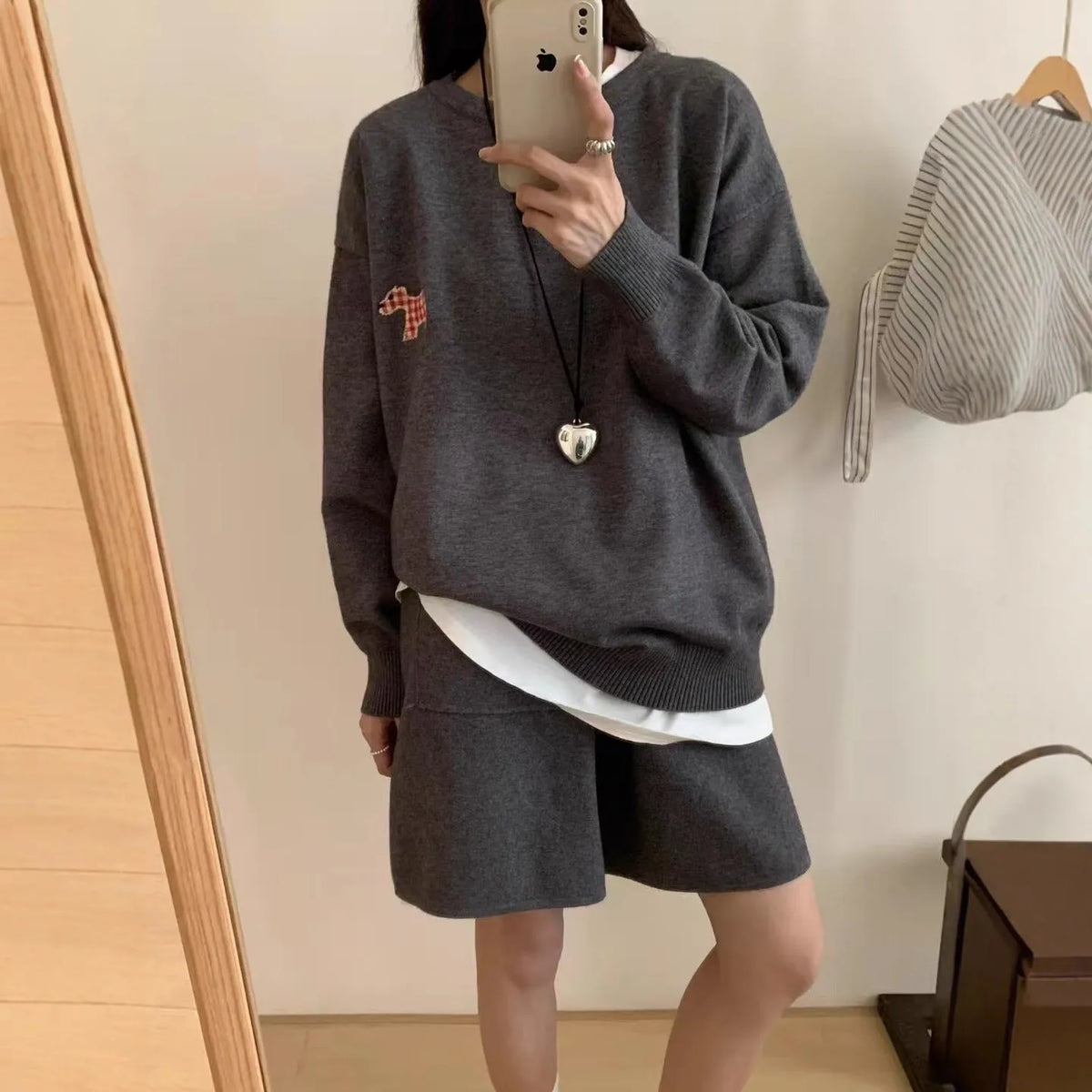Women's milk blue knitted sweater and shorts loungewear set with embroidered animal pattern.
