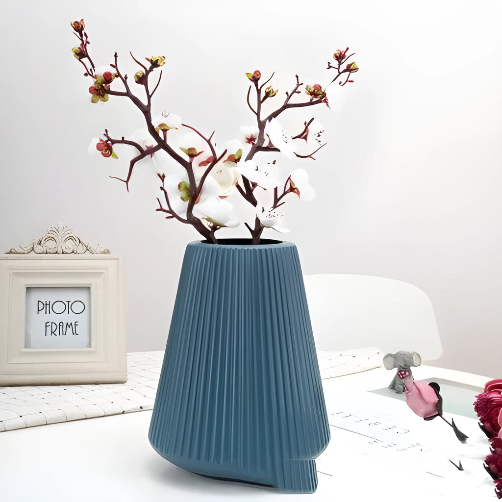 Melamine plastic decorative flower vase in four colours on desktop