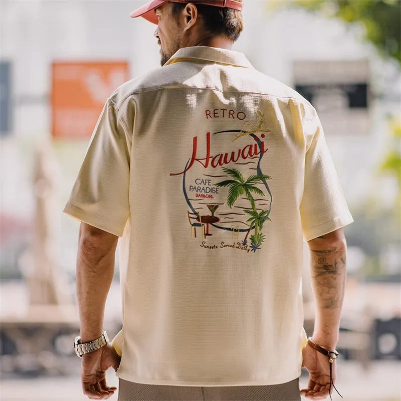 Light apricot men's Cuban collar shirt with bamboo pattern featuring plants and flowers