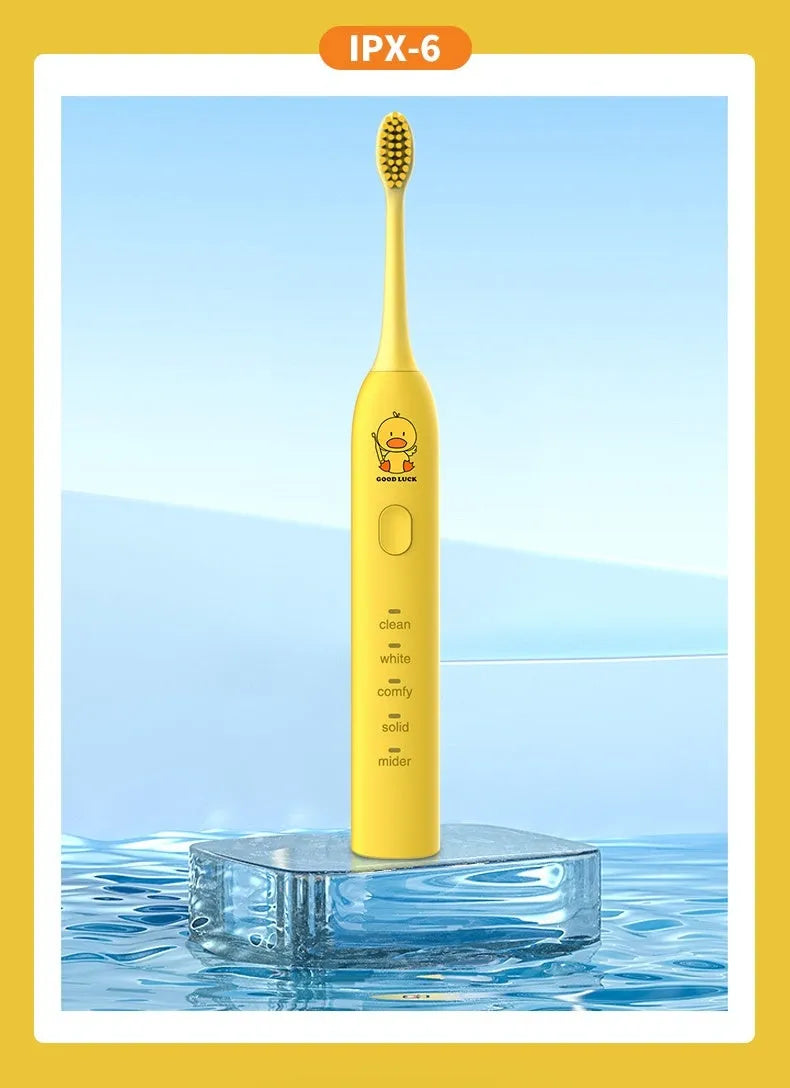 Rechargeable electric toothbrush in yellow with small duck design showing soft bristle brush head