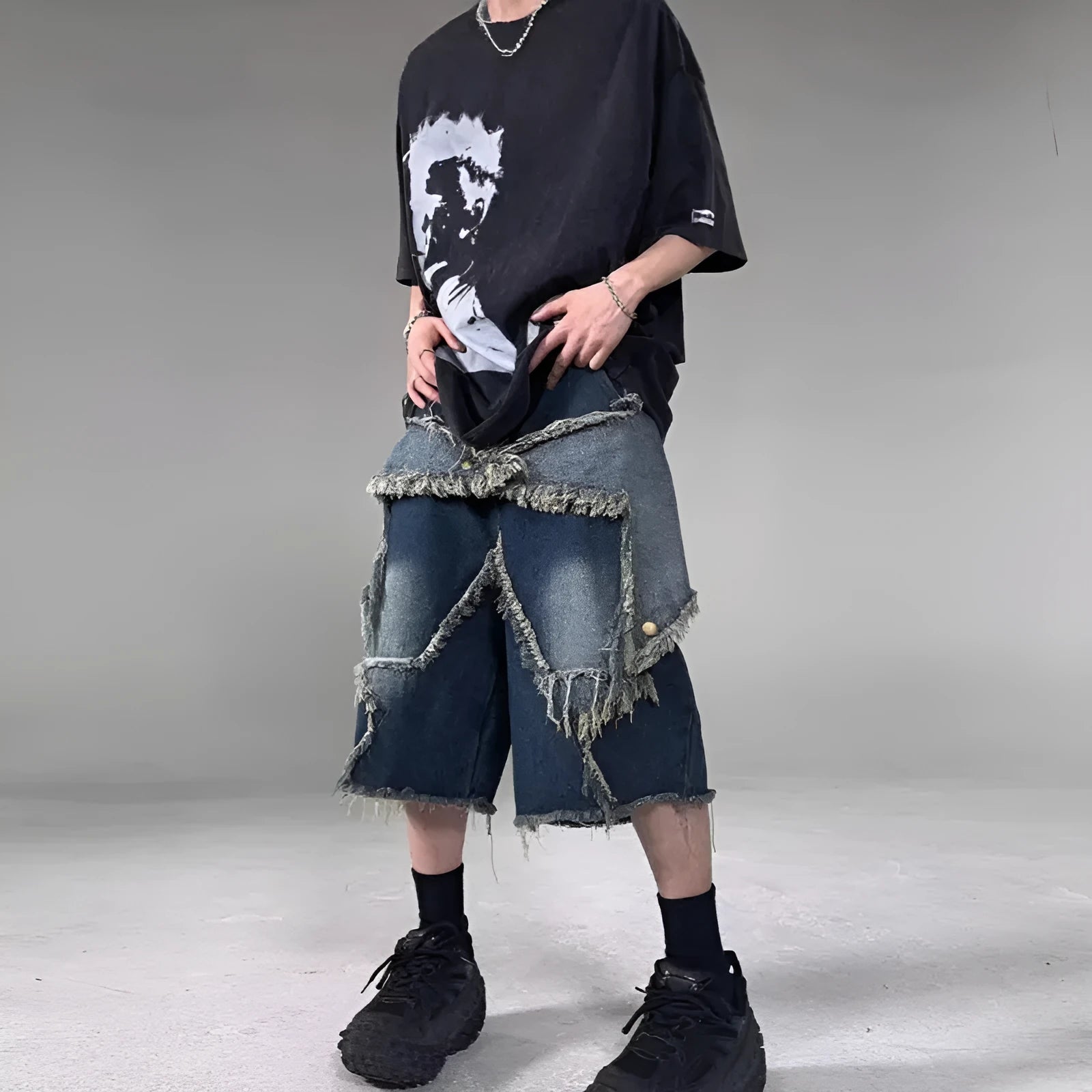 Men's blue retro denim shorts with a frayed five-pointed star design on the leg, showing loose fit.