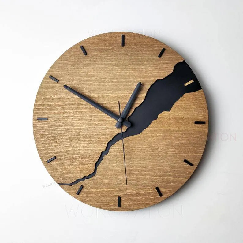 Modern wooden wall clock with a creative crack pattern design on its face, shown in one of five available colour options.