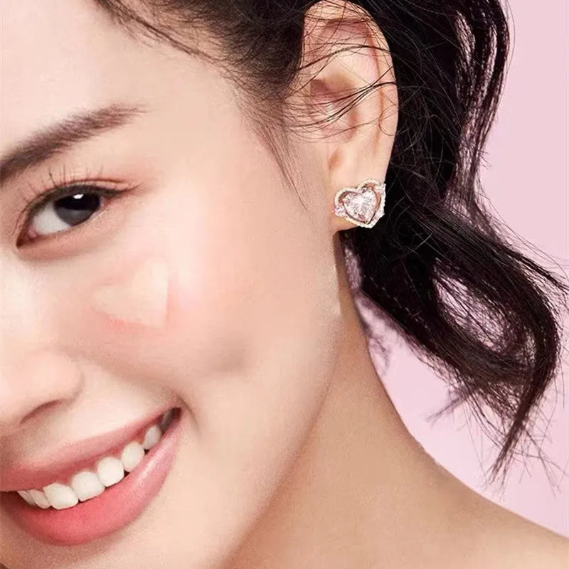 Heart shaped stud earrings with white k finish and copper construction for women