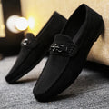 Men's black slip-on loafers with round toe and low heel on a white background