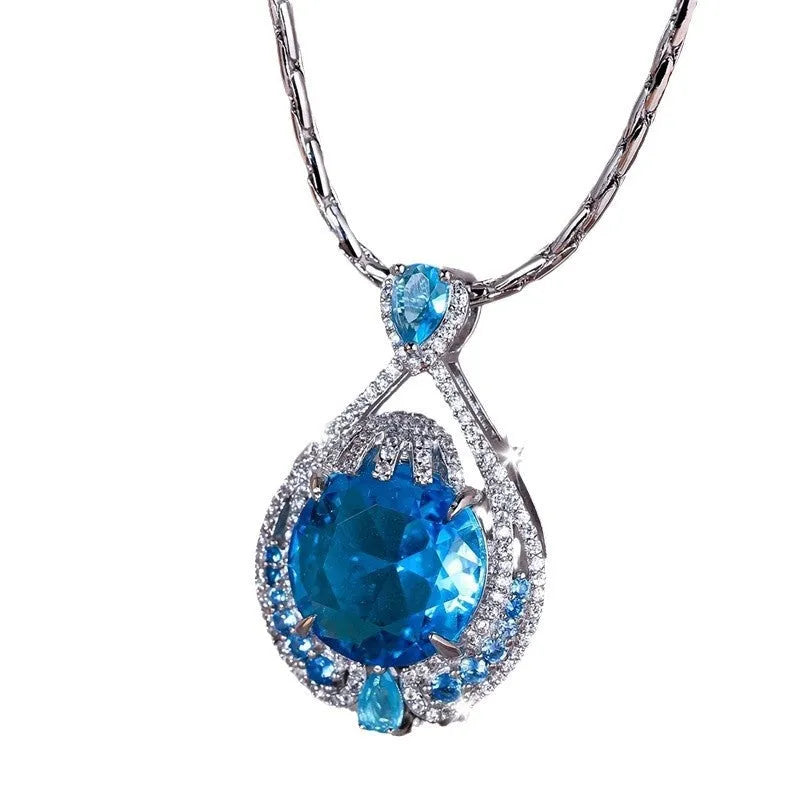 Blue geometric pendant necklace with fireworks cut crystal on a water wave alloy chain for women