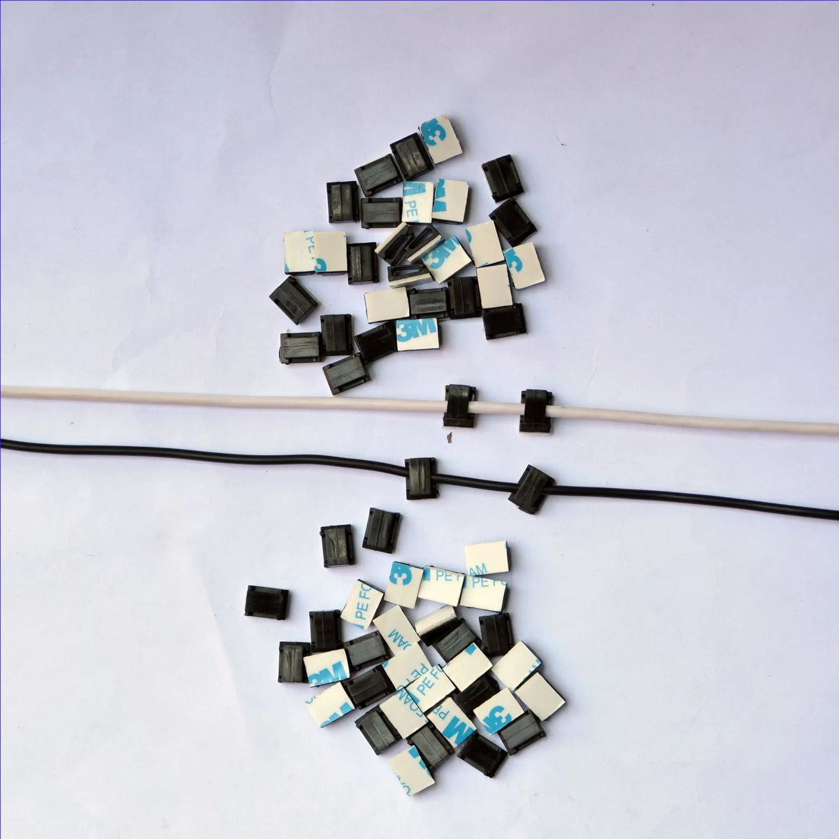 Black PA66 plastic automotive cable retaining clips for wiring management measuring 9mm by 12mm by 6.2mm