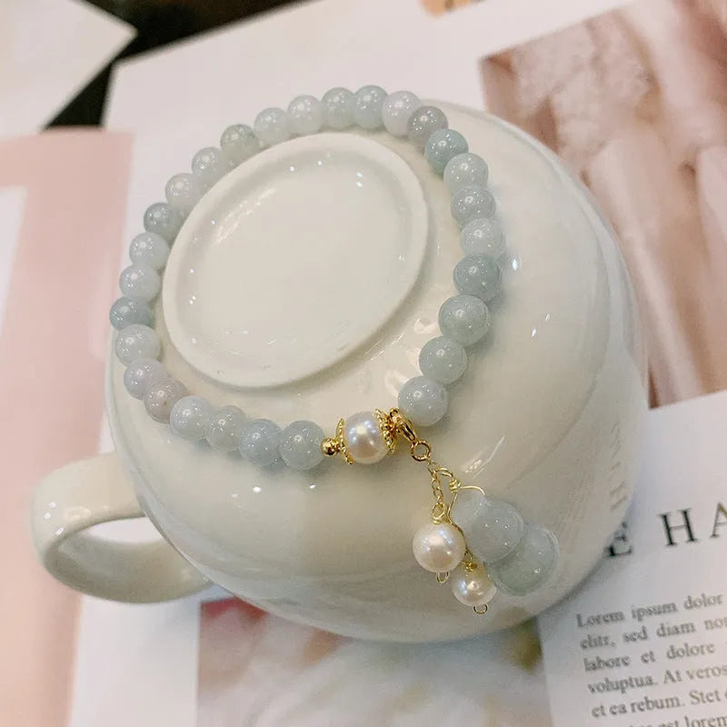Women's jade bracelet with natural emerald jade insets and gourd design in Chinese style