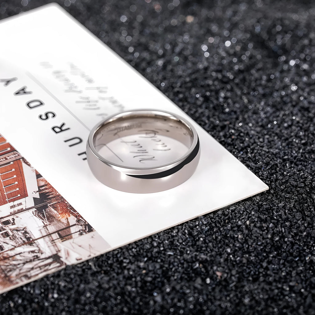 Polished silver titanium steel unisex ring showing 2mm 4mm 6mm width options with US sizing
