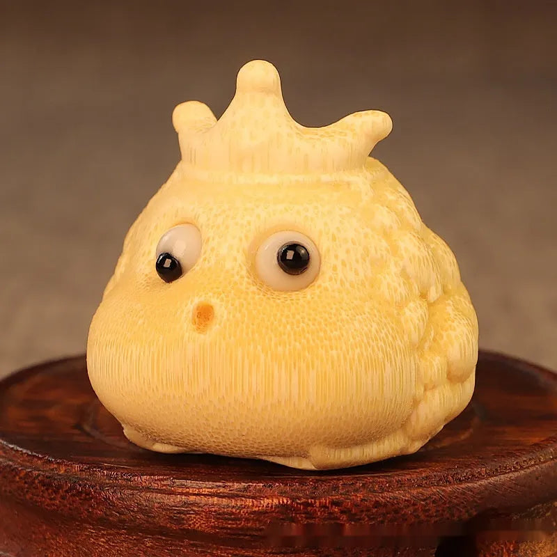 Solid bamboo Crown Princess Toad carving ornament in cute style on a plain background.