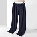 Men's black Ice Silk loose-fit casual trousers with an elasticated waistband on a plain background.