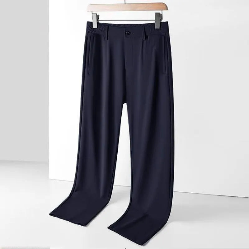 Men's black Ice Silk loose-fit casual trousers with an elasticated waistband on a plain background.